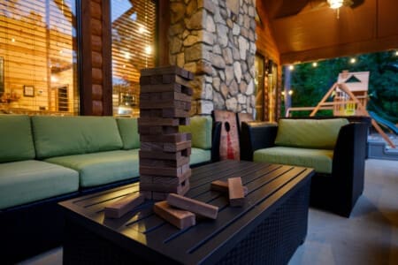 Relaxing with a game of Jenga in our cabin's outdoor oasis