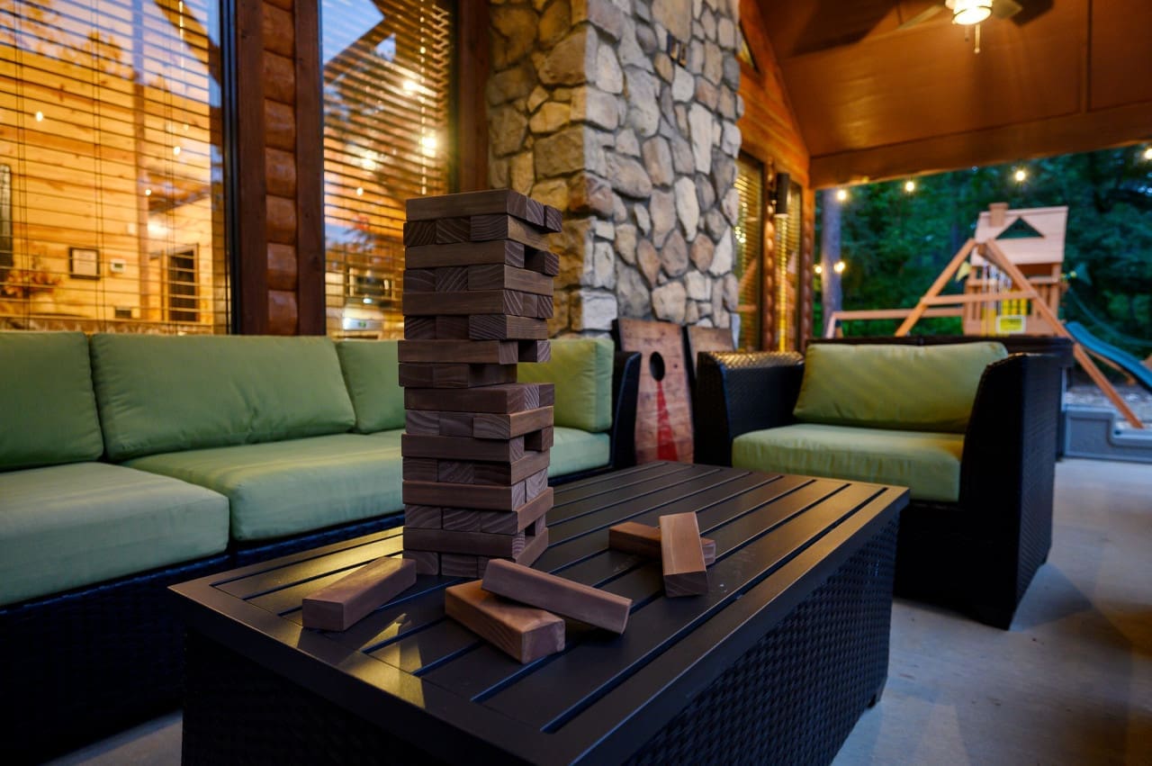 Relaxing with a game of Jenga in our cabin's outdoor oasis
