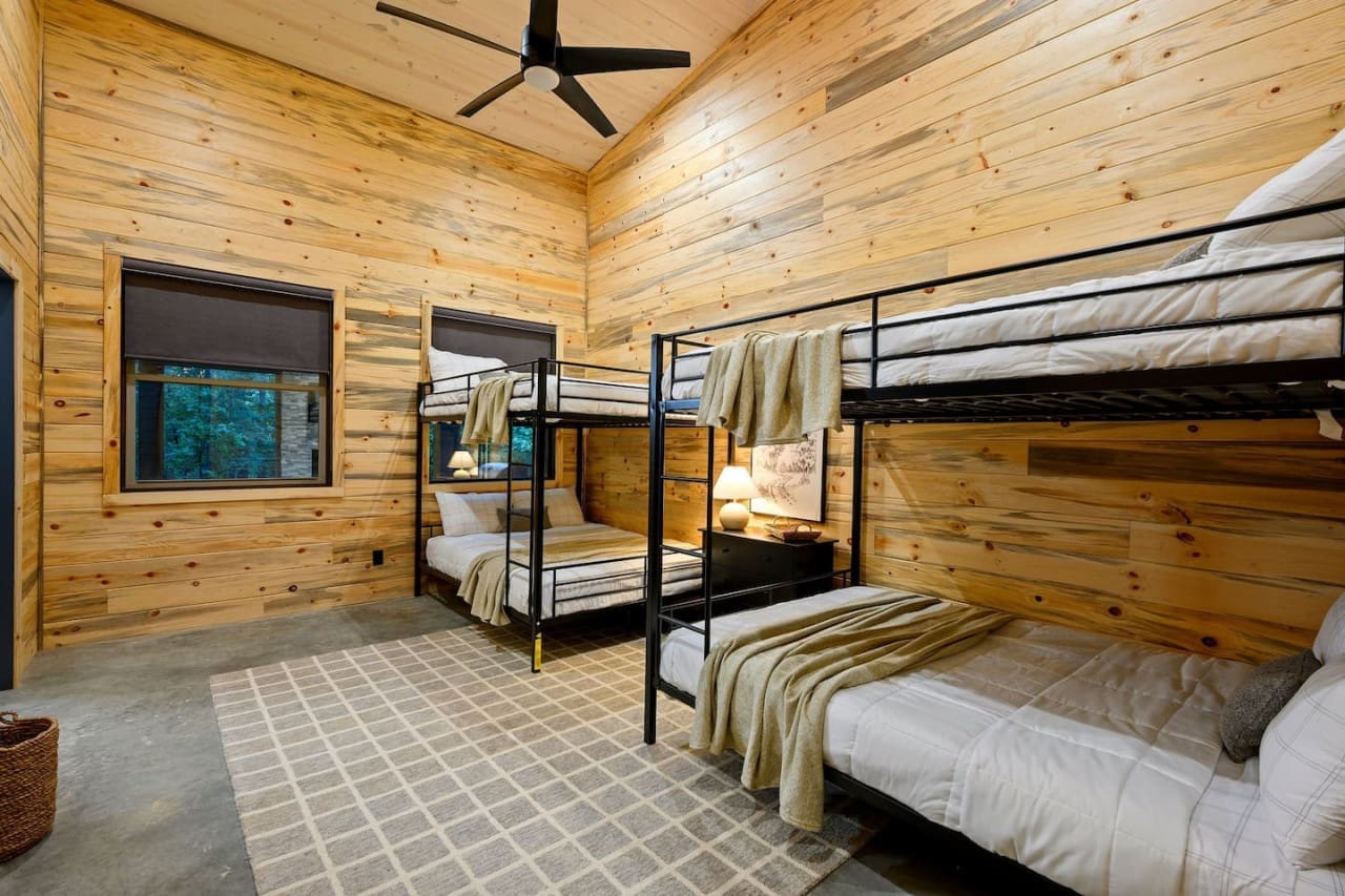 Rustic comfort, doubled: our cabin's bunk bed delight.