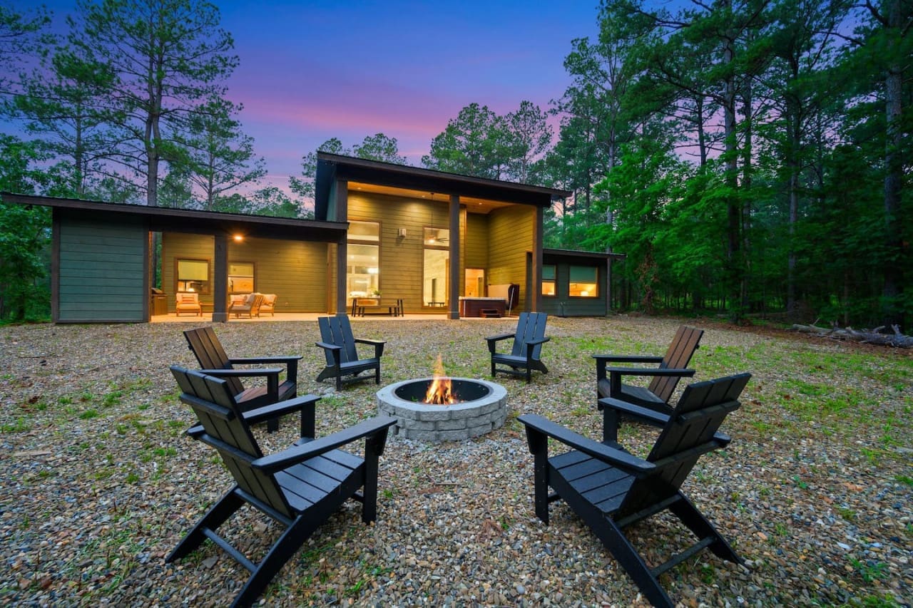 Where laughter echoes and flames dance: our cabin's fire pit.