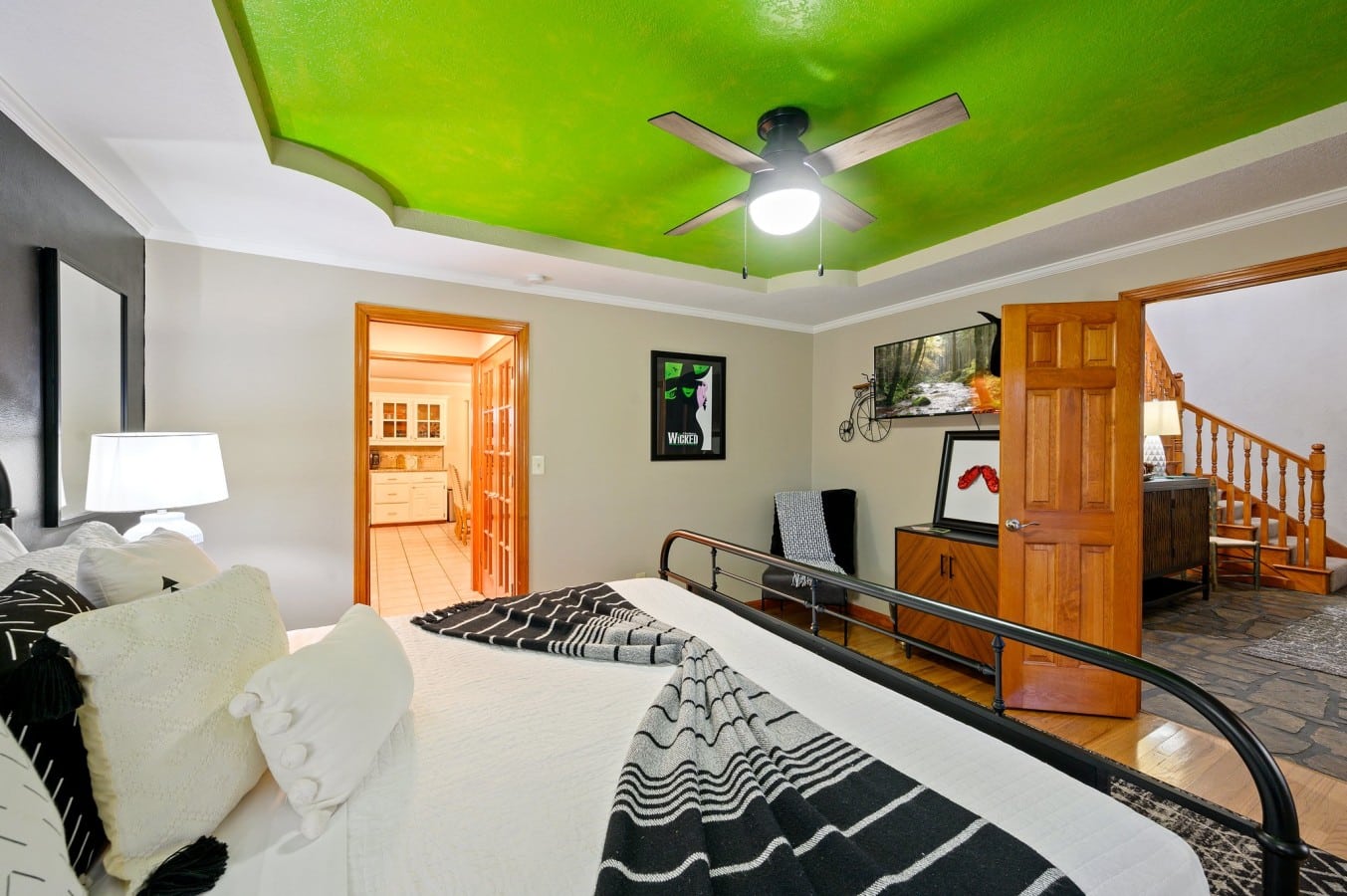 King bedroom angle showing the seating area and entry.