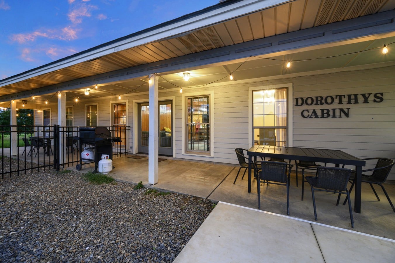 Rear exterior showing the covered patio and Dorothy's Cabin sign.