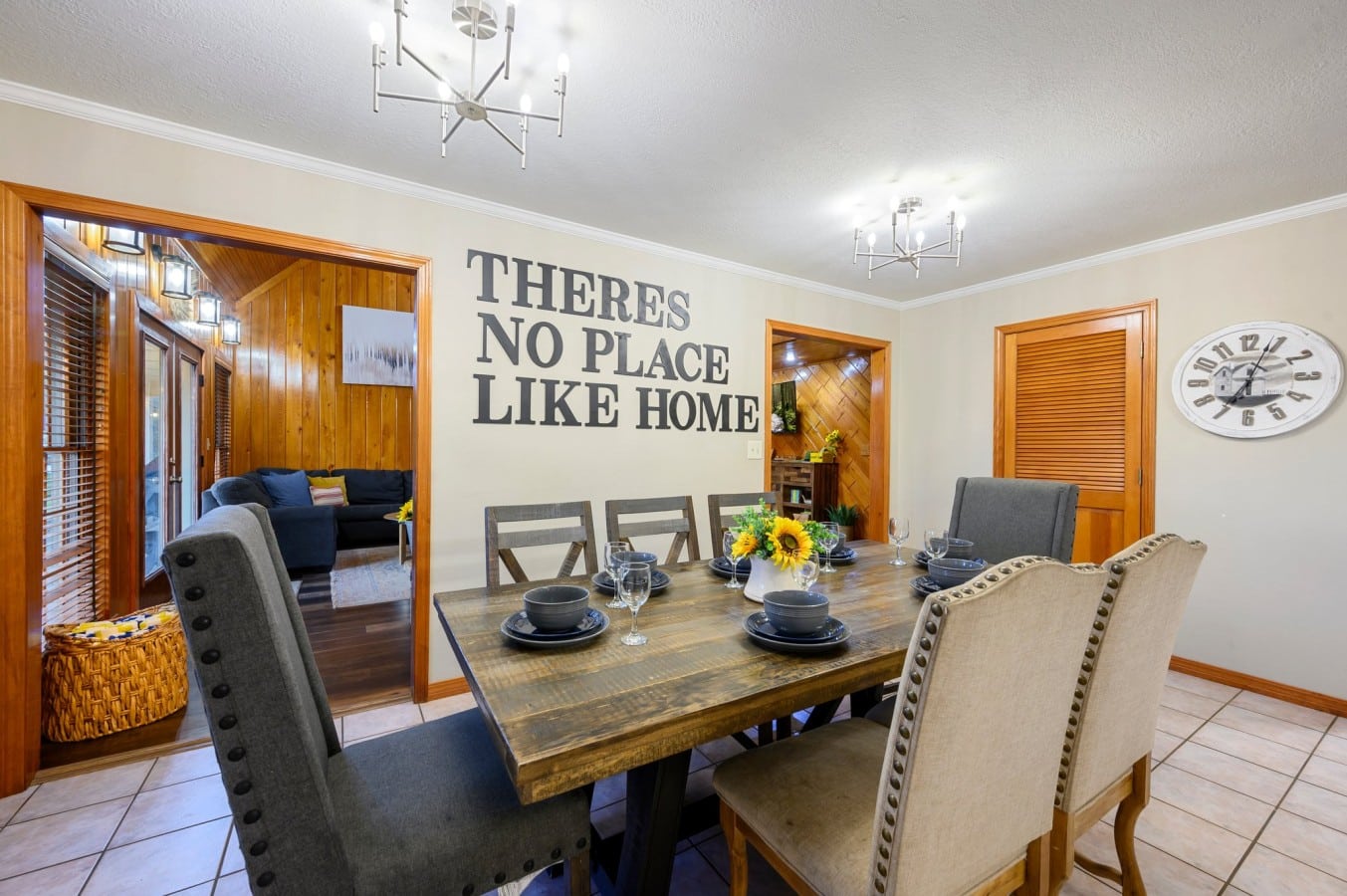 Dining table set for group meals near the kitchen.