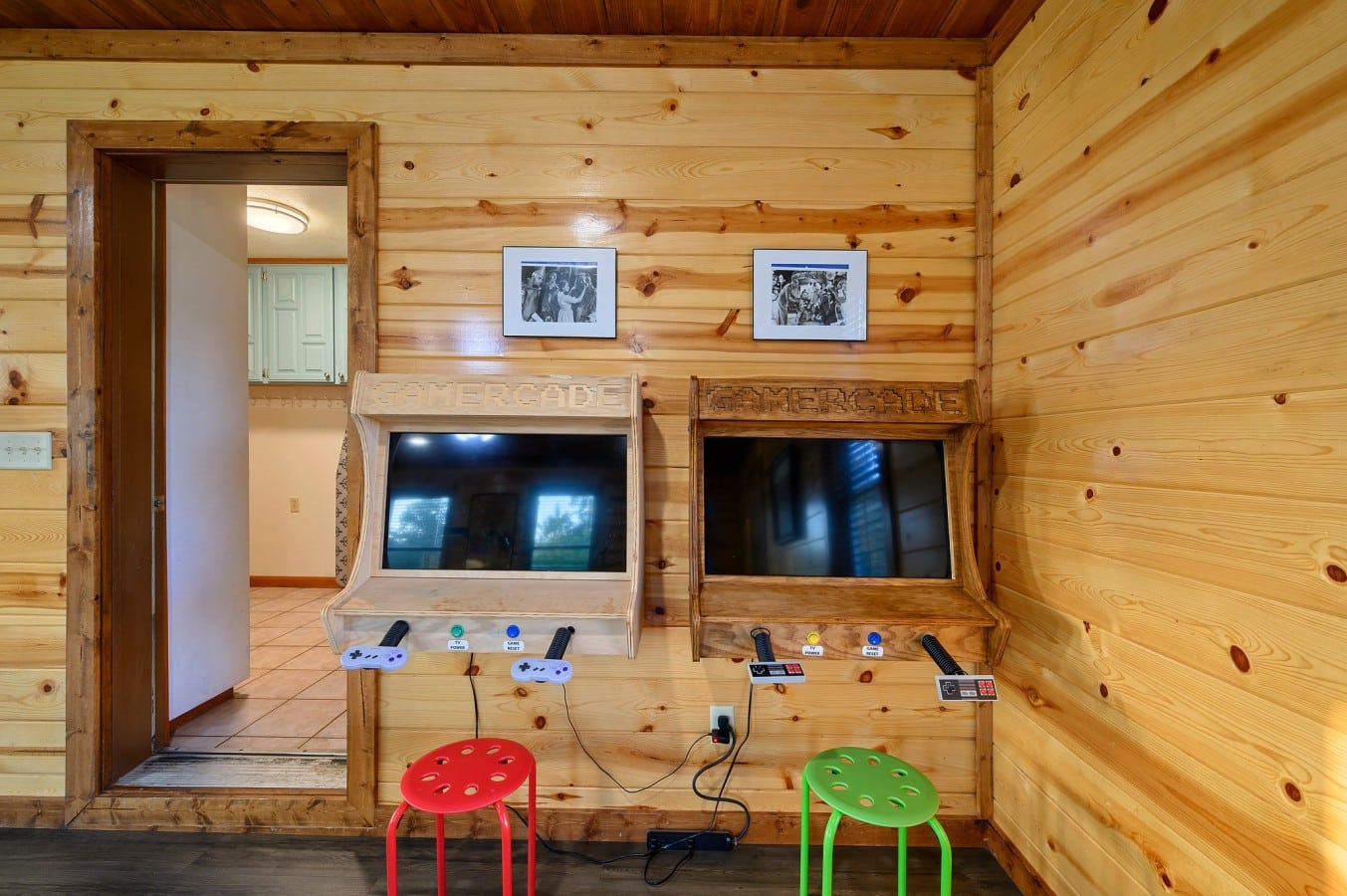 Kids' play area with mounted TV and colorful seating.