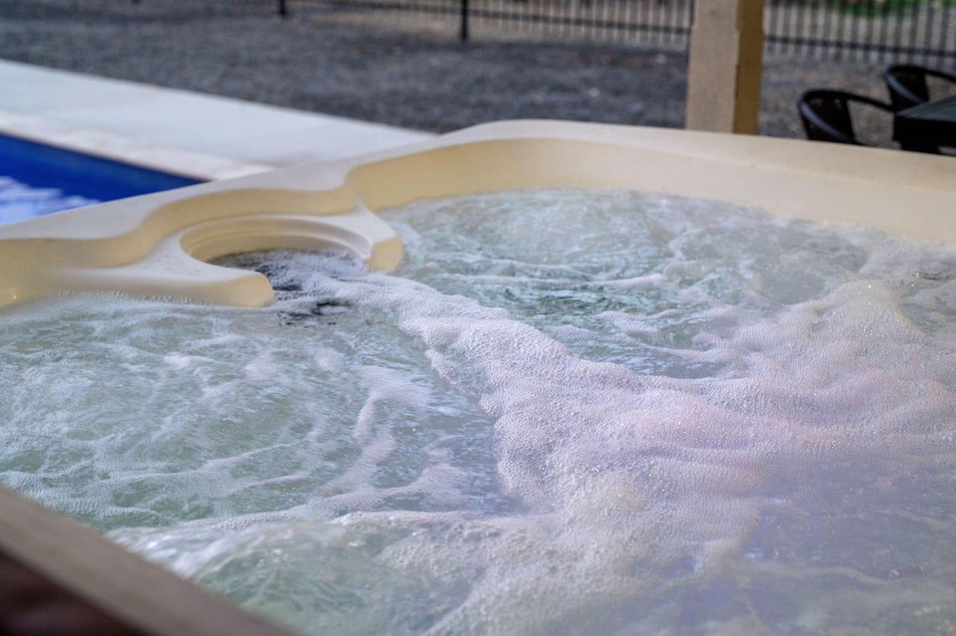 Bubbling hot tub detail with the pool area just steps away.