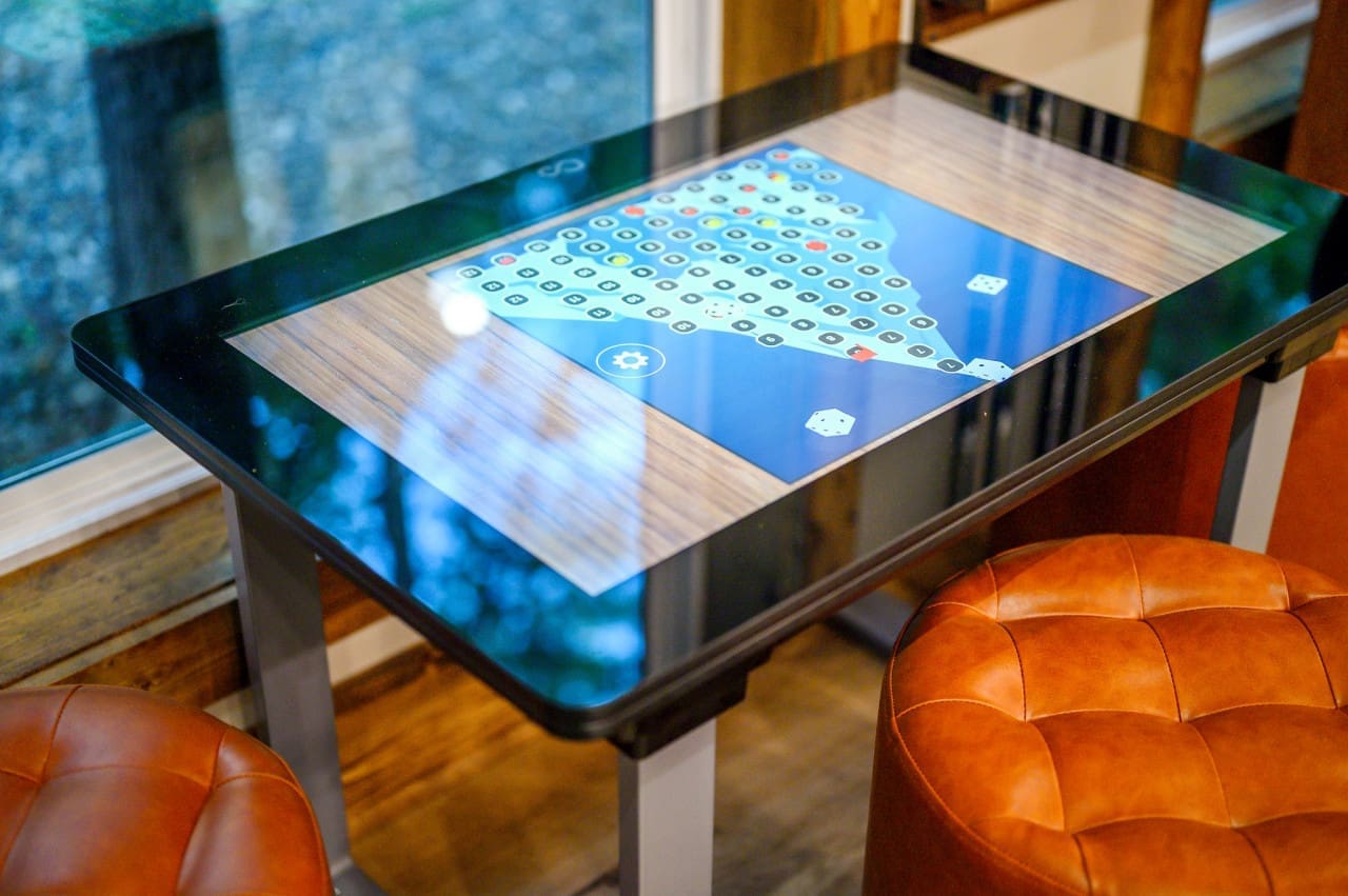 Game on! Our electronic game table brings the thrill of arcade action right to your living space.