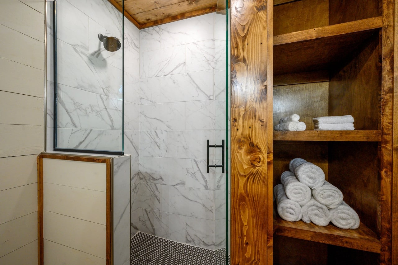 Embrace the luxury of a spa-like experience at home with our contemporary glass door shower.