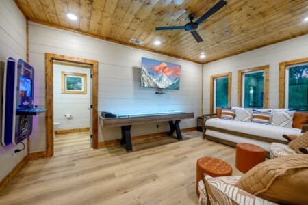 Enjoy endless entertainment in our living room, designed for both cozy lounging and thrilling game nights.