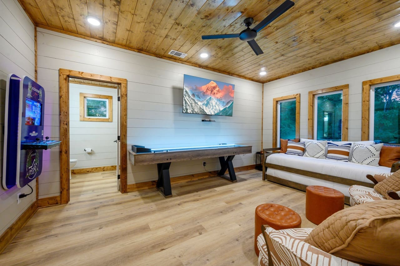 Enjoy endless entertainment in our living room, designed for both cozy lounging and thrilling game nights.