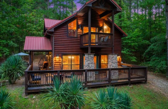 Discover the hidden charm of our cabin's secluded back view, surrounded by nature.