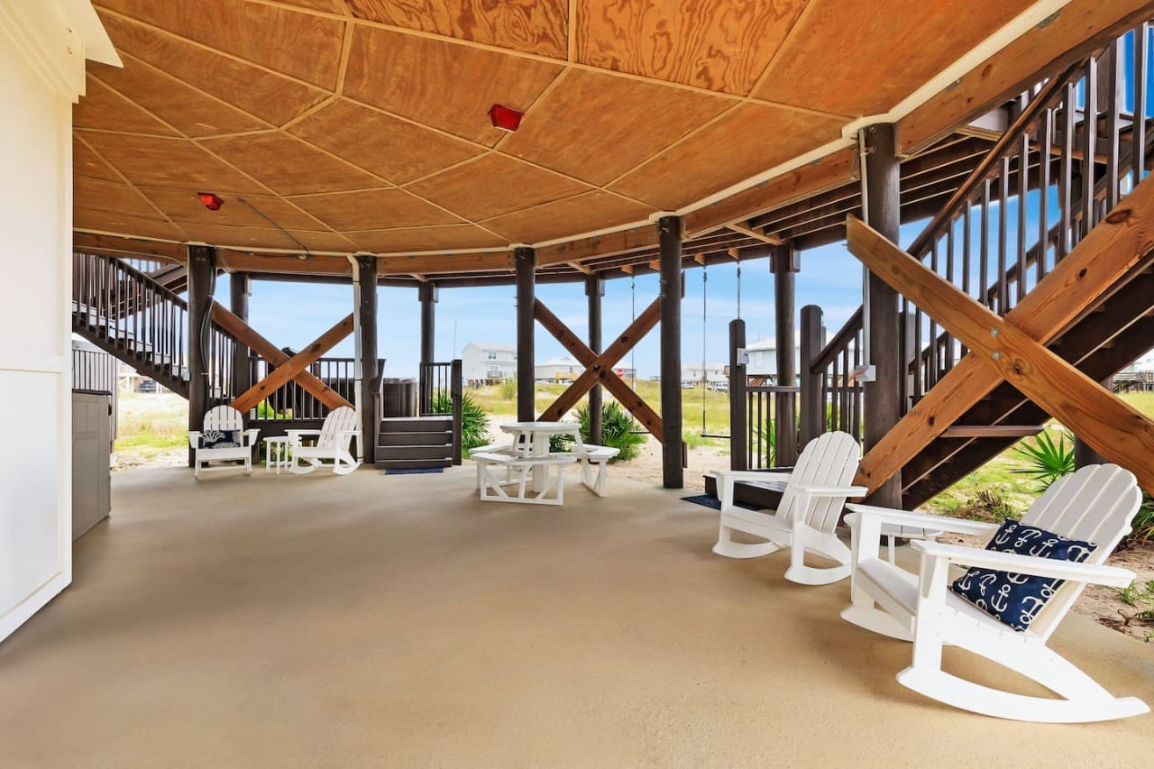 Serene Seating: Enjoy tranquility under our cabin's shaded wooden chairs.