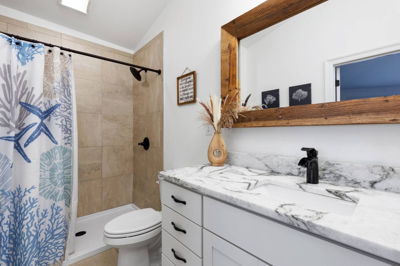 Colorful Statement: Infuse personality and charm with a vibrant shower curtain.