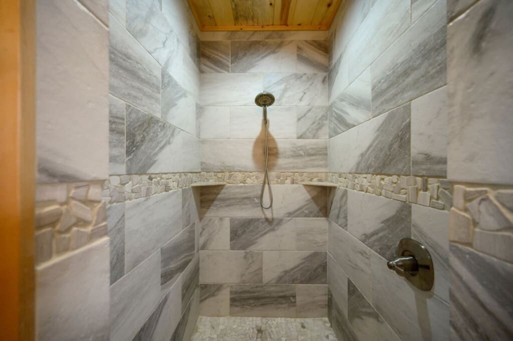 Step into luxury with a beautifully tiled shower experience.