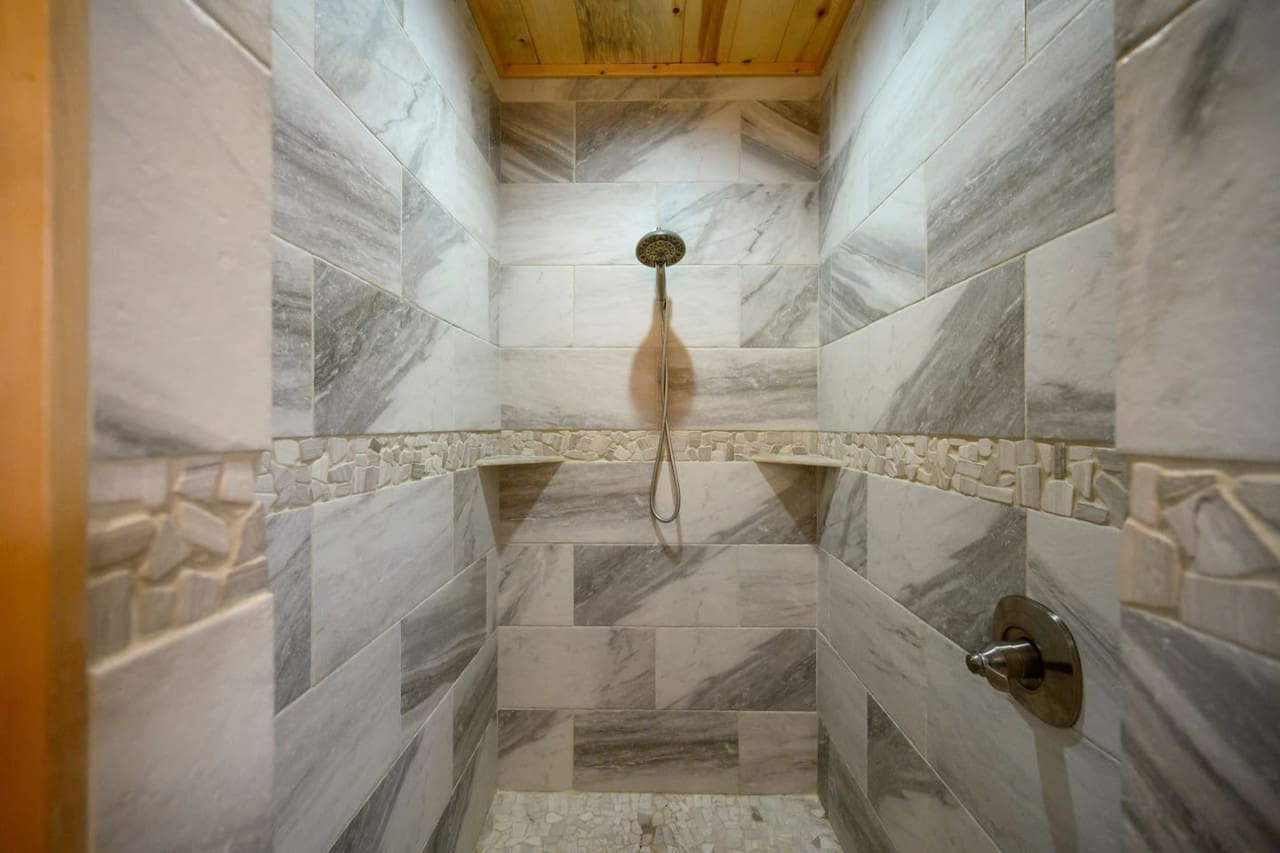 Step into luxury with a beautifully tiled shower experience.