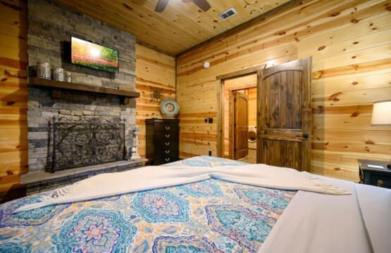 Step into comfort and warmth—our cabin’s bedroom is the perfect blend of cozy elegance and restful bliss.