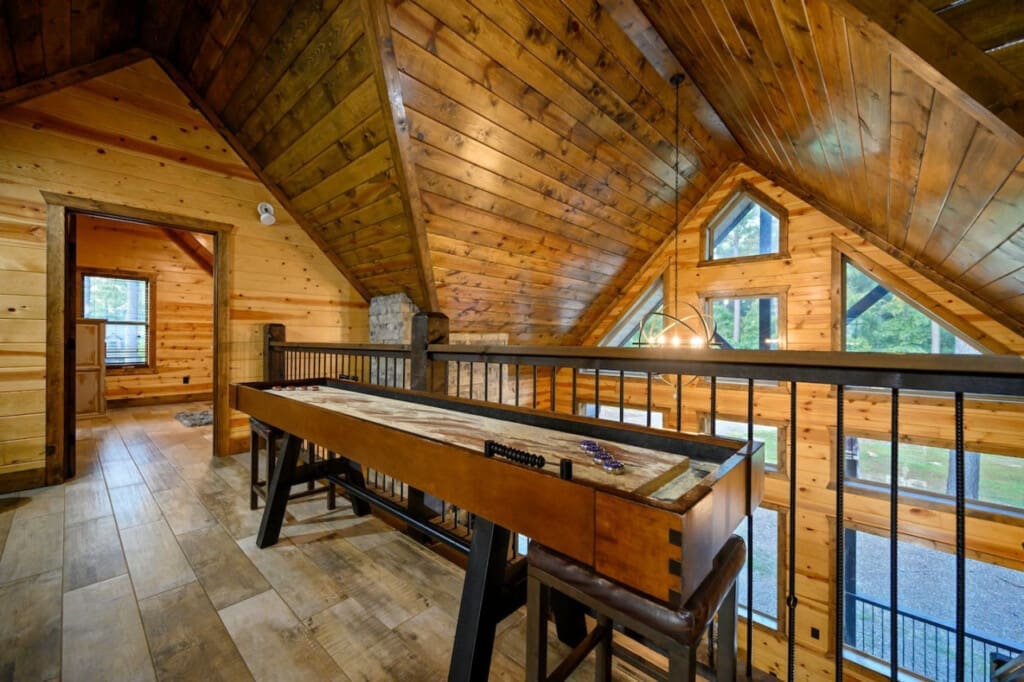 Gather around the shuffleboard table for friendly competition and unforgettable memories in your cozy retreat.