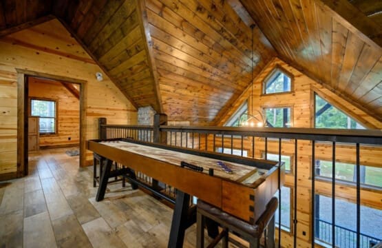 Gather around the shuffleboard table for friendly competition and unforgettable memories in your cozy retreat.