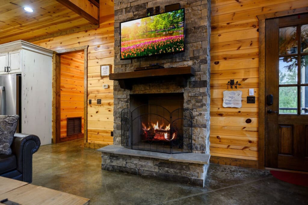 Cozy up by the fireplace while enjoying your favorite shows—where warmth and entertainment come together perfectly.