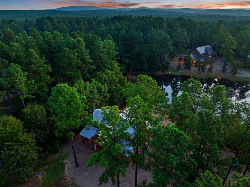 Immerse yourself in nature with our cabin, beautifully framed by a canopy of trees that offer shade, serenity, and stunning views.