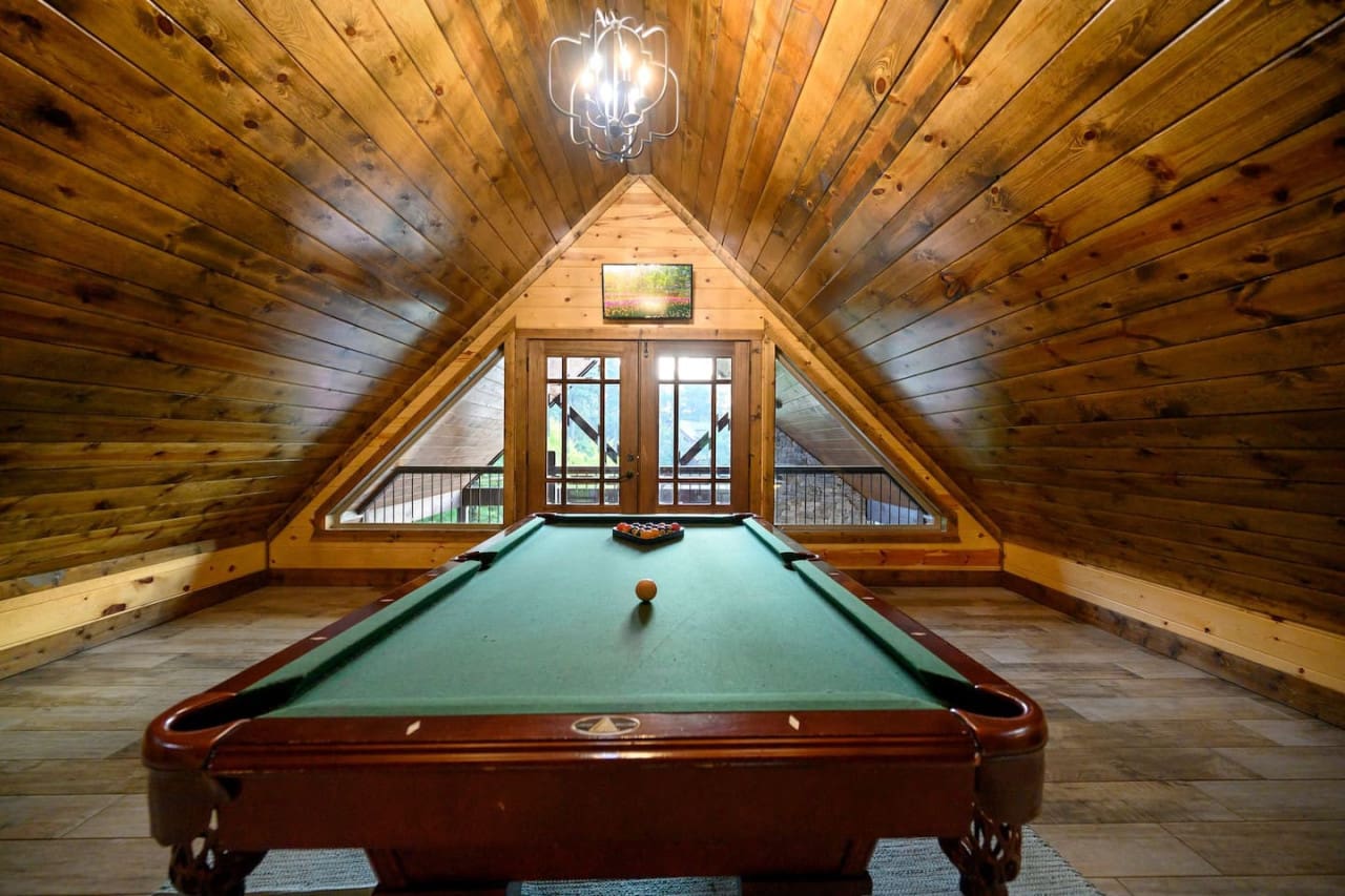 Elevate your cabin getaway with a game of pool—where relaxation meets recreation.