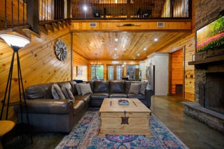 Unwind and relax on our plush sofa, where every moment becomes a comfortable escape in your cabin retreat.
