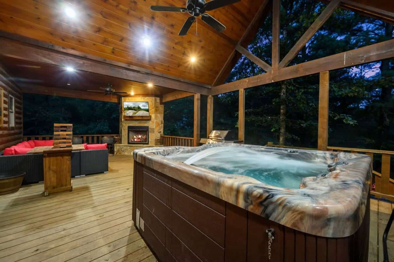 Soak under the stars in this massive hot tub while the fireplace glows behind you and the forest wraps around everything like you've got your own private slice of heaven.