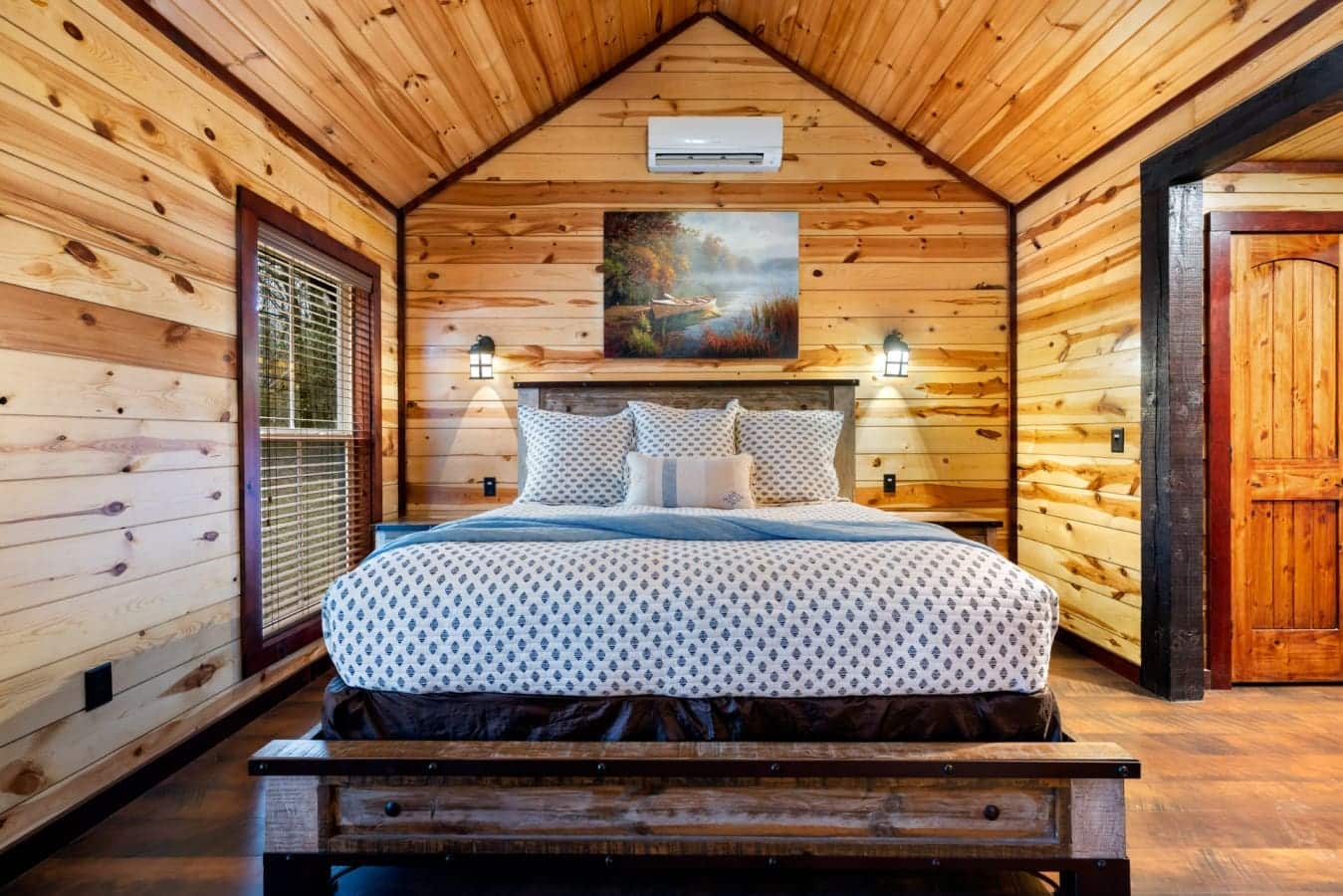The room is styled as a romantic retreat with modern comforts