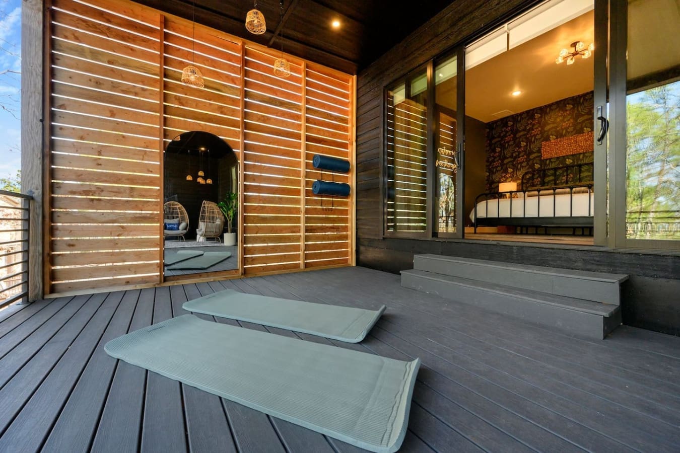 This zen yoga deck with those perfectly rolled mats just waiting for you and the serene forest views beyond is basically calling you to slow down and stretch out in the fresh air.