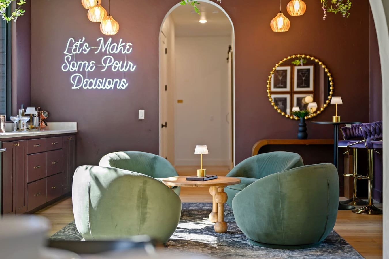 This lounge feels like the ultimate spot to make some actual decisions—you've got those dreamy teal chairs, warm ambient lighting, and that cheeky neon sign keeping things fun while you figure out what's next.