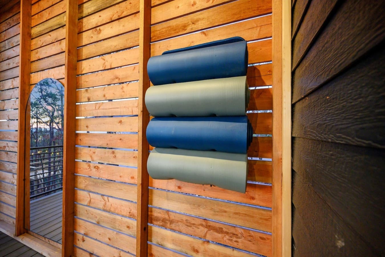 These rolled-up yoga mats stashed along the slatted wooden wall are a nice reminder that this place is all about helping you find your zen, whether you're doing downward dog on the deck or just taking a moment to breathe in that fresh forest air.