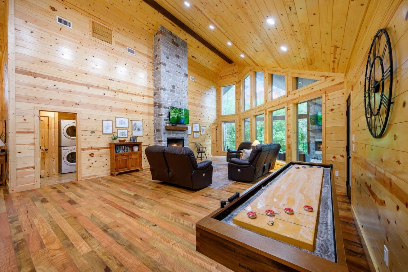 Play shuffleboard or relax by the fireplace in this bright, open living room.