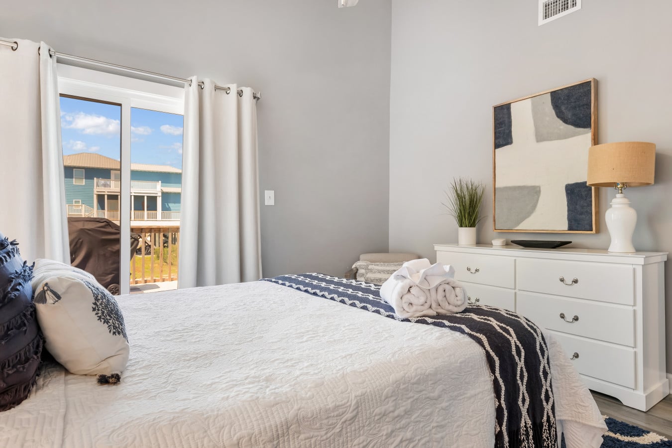 Soft linens, stylish furniture, and a room made for relaxation.