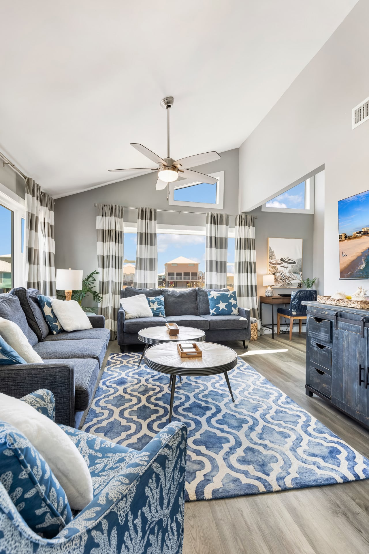 Modern comfort meets coastal charm in this bright, airy living space.