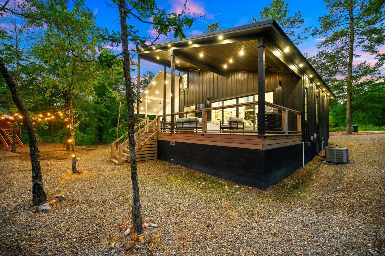 Evenings on the porch, wrapped in string lights and stillnessu2014this is cabin magic.