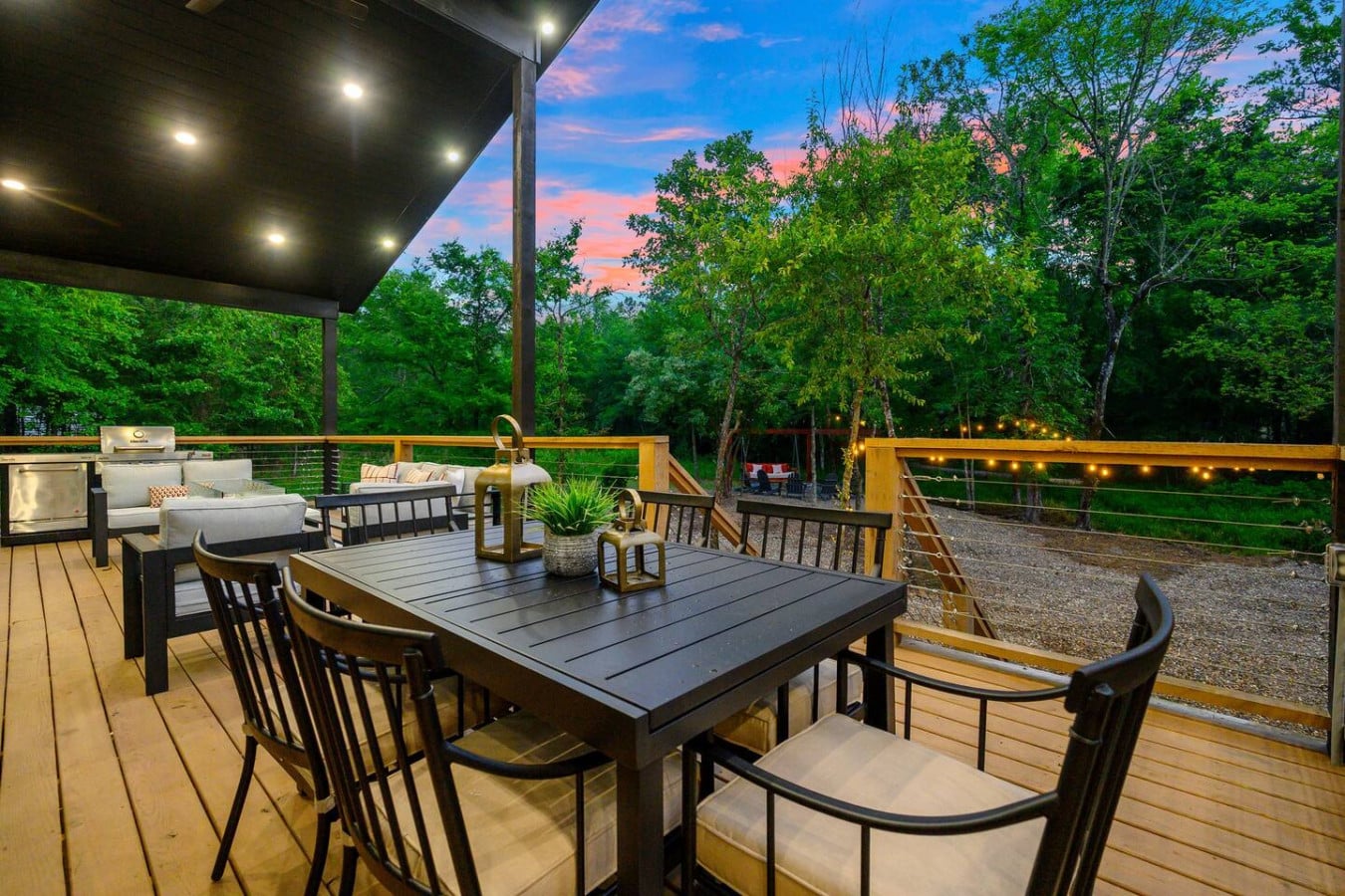 Dine al fresco beneath the twinkle lights and forest canopy