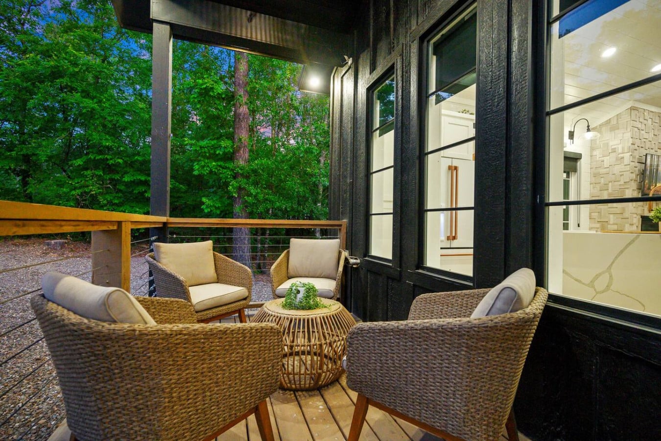 Tucked into the trees, this front porch nook is made for slow mornings, soft conversations, and stargazing nights.