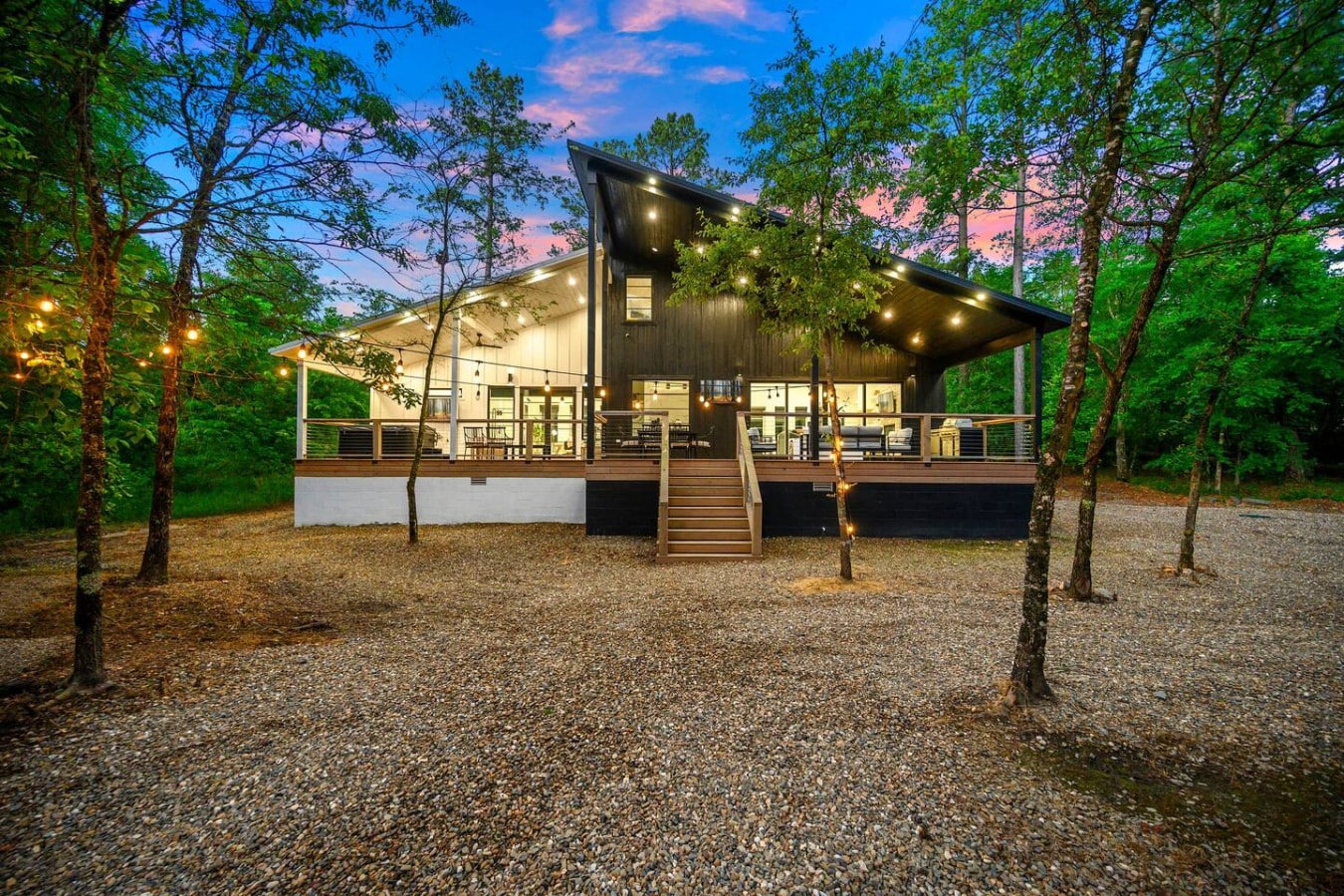 Surrounded by trees, soaked in sunset glow, and lit for long eveningsu2014this modern cabin retreat is pure magic.