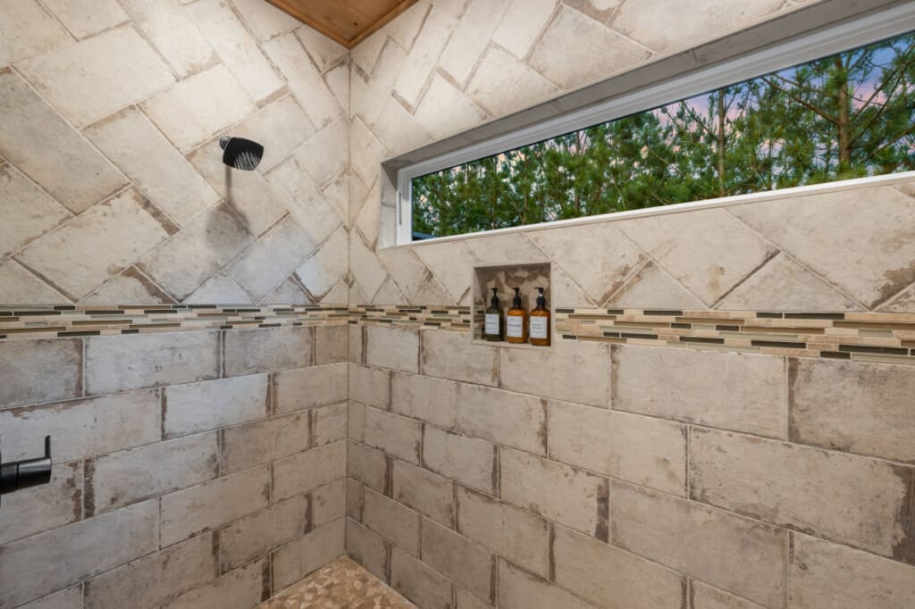 As water cascades over you, feel the invigorating sensation of nature's touch and the gentle embrace of the elements.