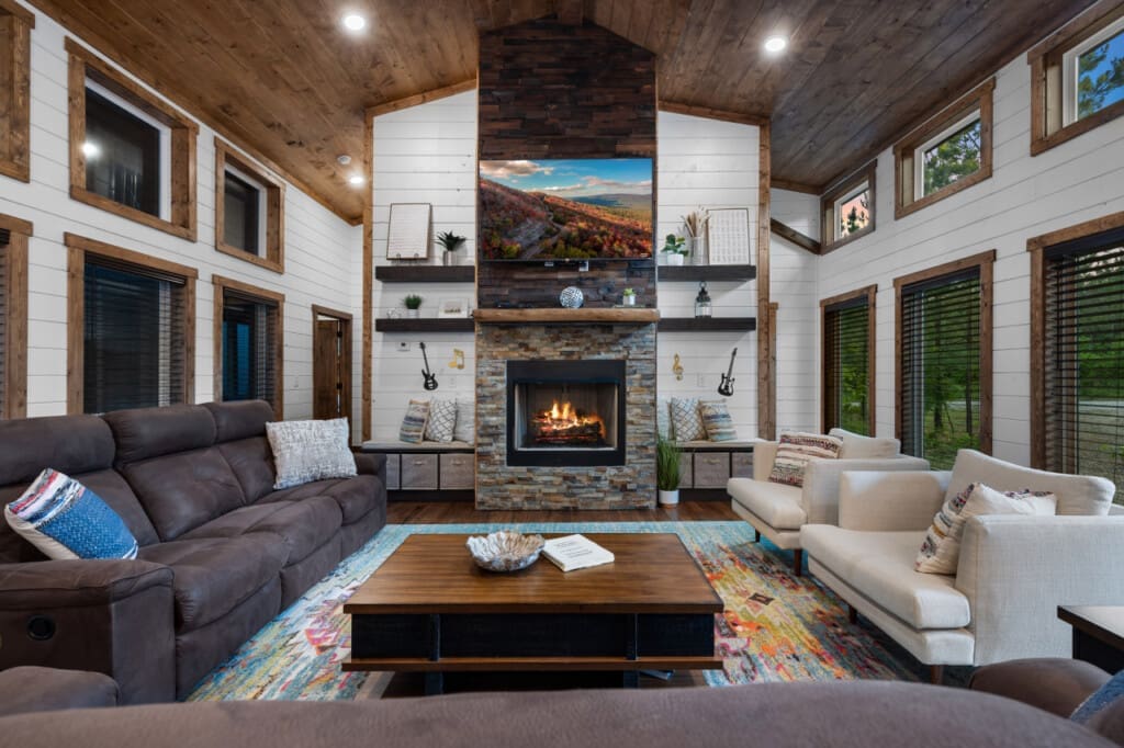 Experience the perfect blend of comfort and charm in our living room, centered around the inviting glow of the fireplace.