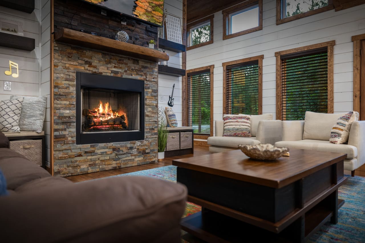 Let the ambiance of our living room fireplace set the stage for cozy gatherings and intimate conversations.