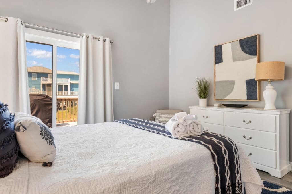 Soft linens, stylish furniture, and a room made for relaxation.