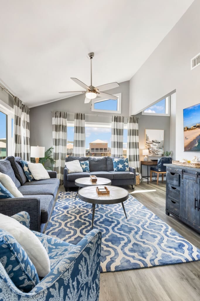 Modern comfort meets coastal charm in this bright, airy living space.