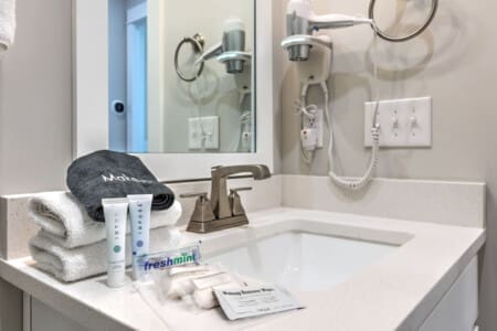 You'll find everything you need to freshen up in this spotless bathroom, complete with modern fixtures, plenty of counter space, and those thoughtful little touches that make a stay feel a little more like home.