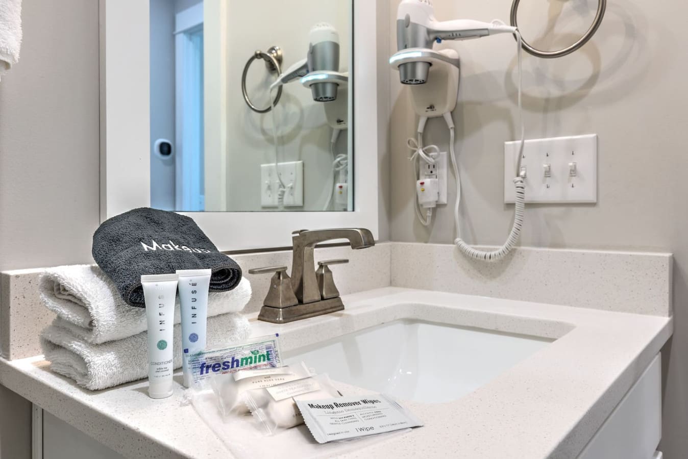 You'll find everything you need to freshen up in this spotless bathroom, complete with modern fixtures, plenty of counter space, and those thoughtful little touches that make a stay feel a little more like home.