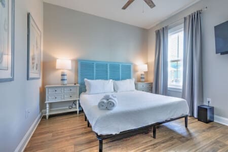 This bright, airy bedroom has all the peaceful coastal vibes you need to actually sleep in and feel like you're on a proper vacation.