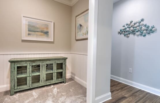 This light-filled nook with its vintage green cabinet and coastal-inspired wall art is the perfect spot to kick back with a book or just soak in the peaceful, beachy vibes.