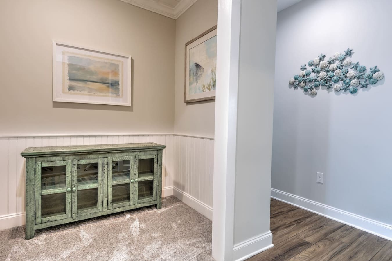 This light-filled nook with its vintage green cabinet and coastal-inspired wall art is the perfect spot to kick back with a book or just soak in the peaceful, beachy vibes.