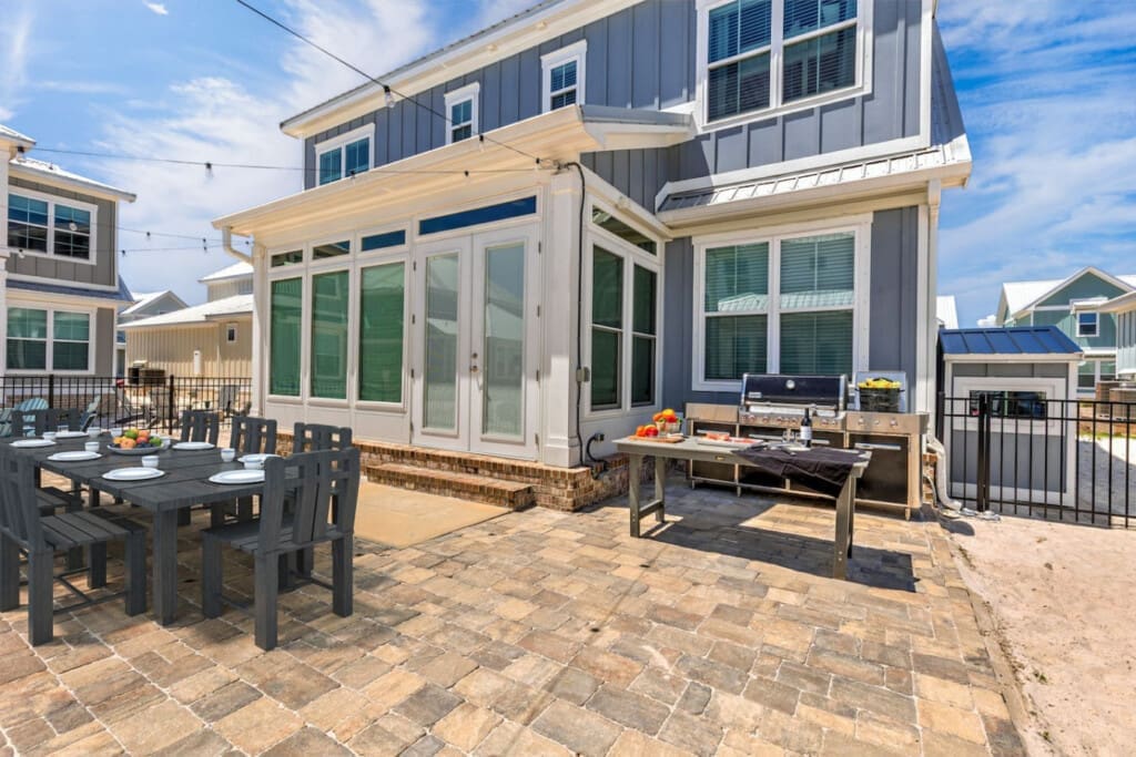 This backyard is basically an all-in-one summer dream with direct beach access, a full outdoor kitchen, and plenty of space to gather with whoever you bring along.