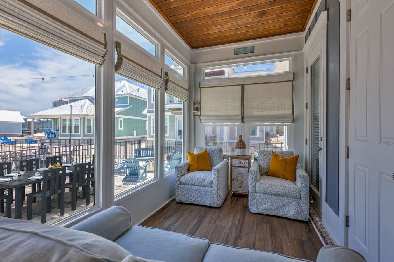 This sunroom is basically the perfect spot to kick back with a good book or just watch the beach activity unfold right outside your windows.