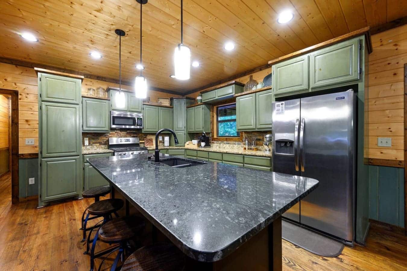 This kitchen's got all the space and gear you need to actually cook real meals without feeling like you're working in a closet, which is basically half the battle when you're feeding a bunch of people.